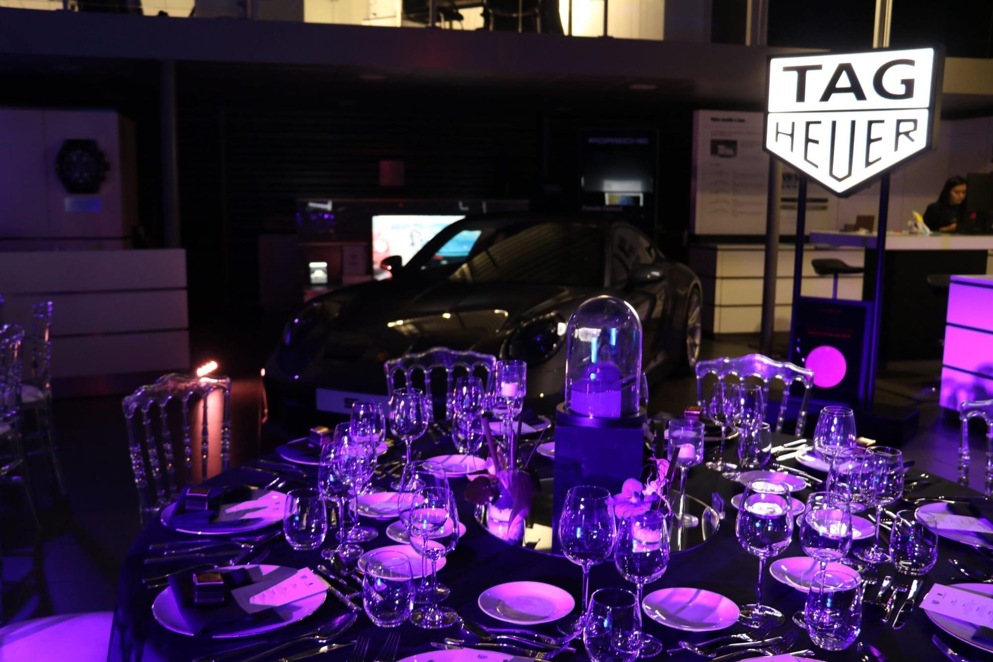 Fine-dining table setting beside a Porsche at the TAG Heuer × Porsche evening